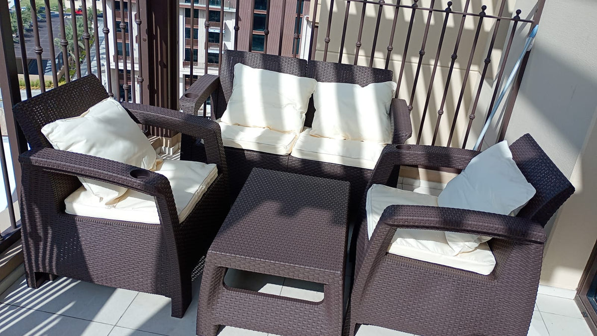 Customer photo: dark brown Havana 4-seater outdoor sofa set with back cushions on a UAE balcony