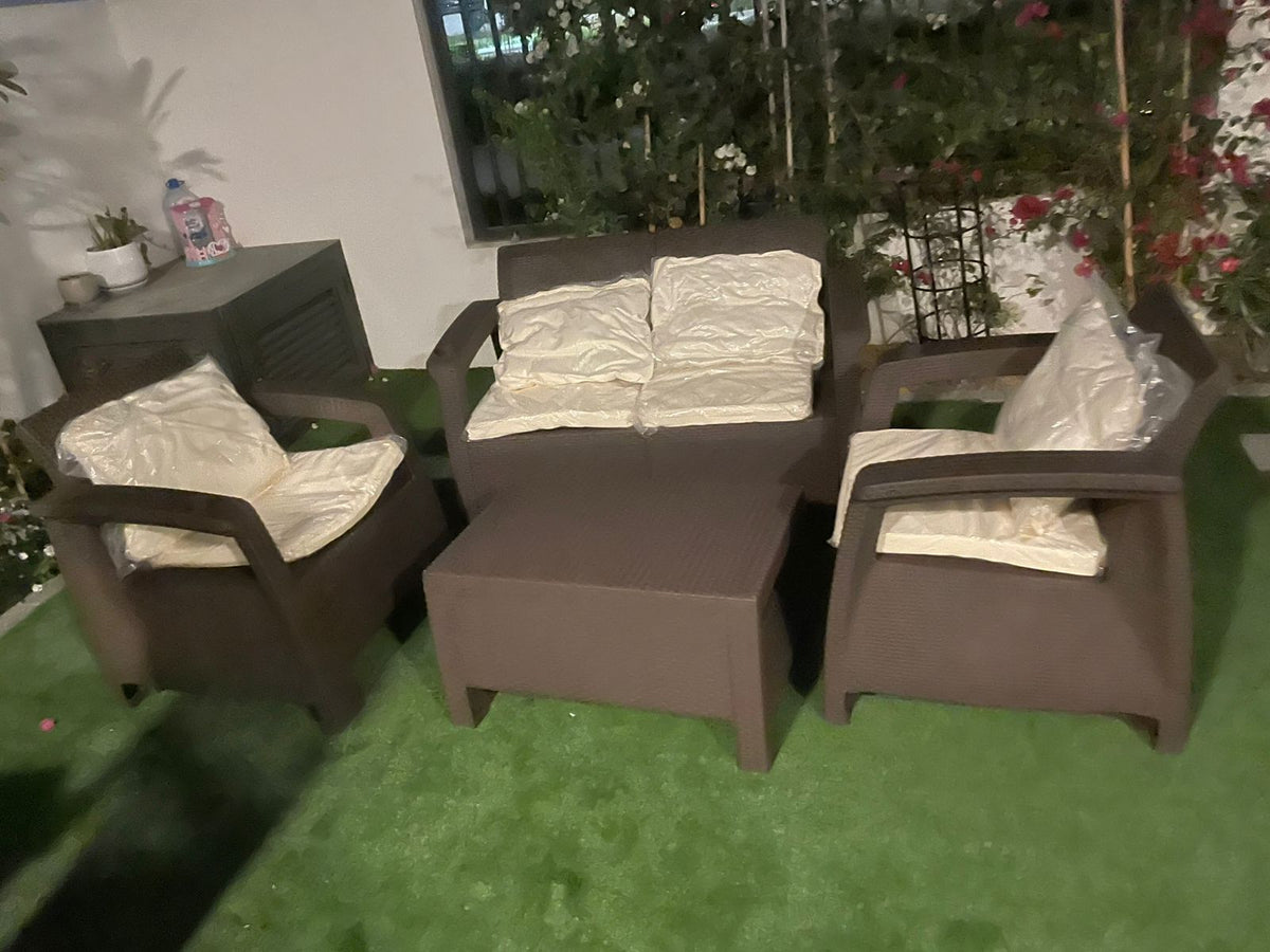 Customer photo: dark brown Havana 4-seater outdoor sofa set with back cushions in a UAE garden