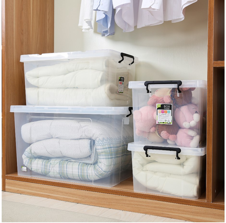 Marcolo clear storage boxes in a wardrobe holding bedding and toys