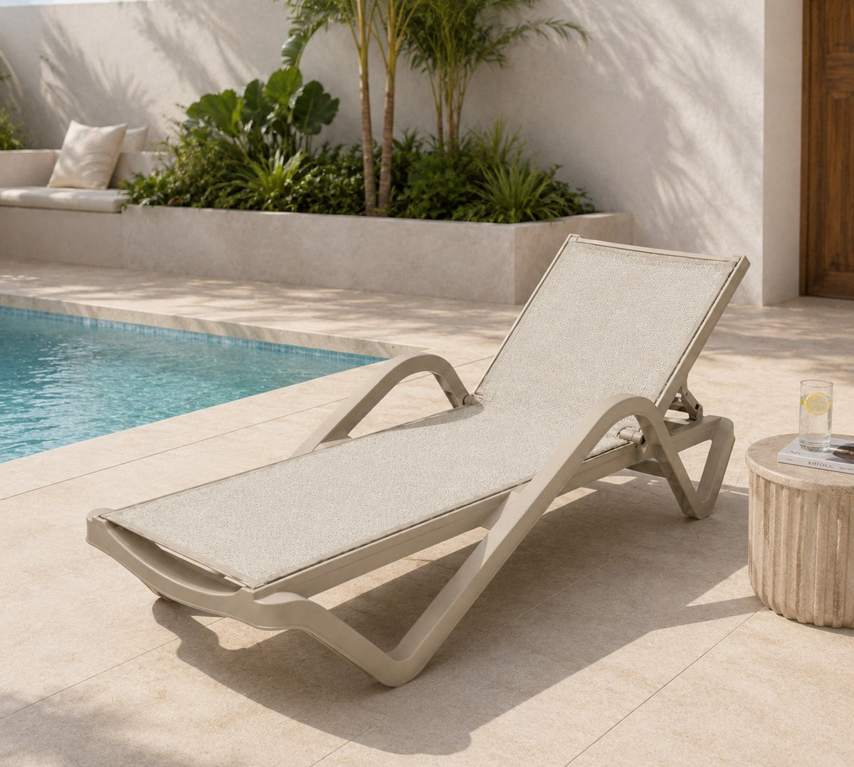 Java Fiberglass Sun Lounger – Beige, by the pool
